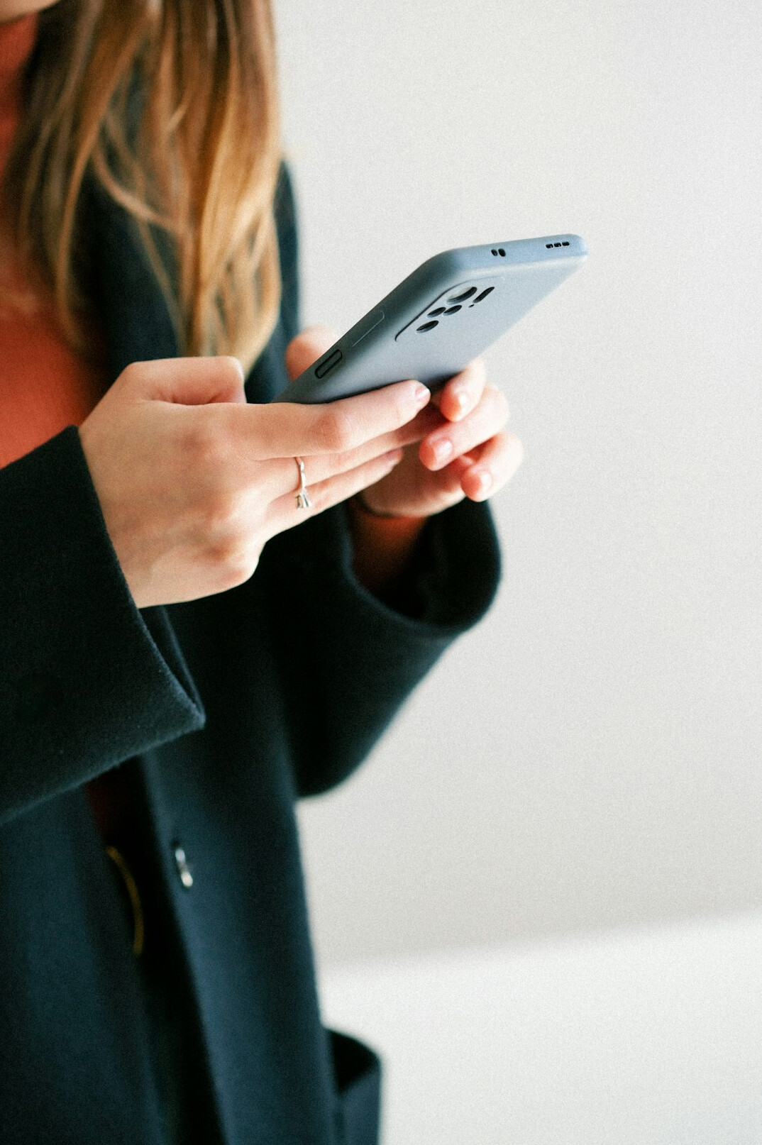 person scrolling smartphone